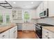 Well-lit kitchen with stainless steel appliances, a butcher block island, and granite countertops at 14220 Stewarts Bend Ln, Charlotte, NC 28277