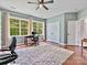 Bright office space with lots of natural light, hardwood floors and a neutral rug at 14220 Stewarts Bend Ln, Charlotte, NC 28277