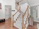 Bright foyer with staircase, hardwood floors, white railings, and natural lighting at 14220 Stewarts Bend Ln, Charlotte, NC 28277