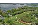 Aerial view showcasing a home's location on a golf course with stunning lake views at 17040 Jetton Rd, Cornelius, NC 28031