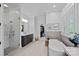 This spa-like bathroom includes a soaking tub, a glass-enclosed shower and closet access at 17040 Jetton Rd, Cornelius, NC 28031
