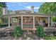 Elegant covered patio featuring a fountain, comfortable seating, and ample space for outdoor entertaining at 17040 Jetton Rd, Cornelius, NC 28031