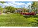 Beautiful brick home with manicured lawn and lush landscaping at 17040 Jetton Rd, Cornelius, NC 28031