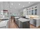 Open kitchen with a large island, stainless steel appliances, and a breakfast nook with a bay window at 17040 Jetton Rd, Cornelius, NC 28031