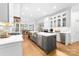 Modern kitchen featuring stainless steel appliances, island, and breakfast bar at 17040 Jetton Rd, Cornelius, NC 28031