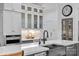 Elegant kitchen with stainless steel appliances, ample counter space, and glass-front cabinetry for display at 17040 Jetton Rd, Cornelius, NC 28031