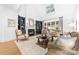 Cozy living room with fireplace, built-in shelving, and comfortable seating at 17040 Jetton Rd, Cornelius, NC 28031
