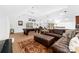 Spacious living room featuring a pool table, bar area, and comfortable leather sectional sofa at 17040 Jetton Rd, Cornelius, NC 28031