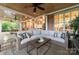 Relaxing outdoor patio with comfortable seating, a coffee table, and a view of the backyard at 17040 Jetton Rd, Cornelius, NC 28031