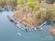 Aerial view of the community boat dock surrounded by water and trees at 1713 Mt Isle Harbor Dr, Charlotte, NC 28214