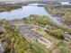 Aerial view of the lake with boat parking and several homes surrounded by trees at 1713 Mt Isle Harbor Dr, Charlotte, NC 28214
