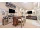 Entertainment area boasts a sleek bar with seating, mounted TVs, and well-stocked bar for gatherings at 1713 Mt Isle Harbor Dr, Charlotte, NC 28214