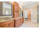 Spacious bathroom with double sink vanity, granite countertops, and tile floors at 1713 Mt Isle Harbor Dr, Charlotte, NC 28214