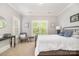 Comfortable bedroom with a white bed, natural light, and classic decor at 1713 Mt Isle Harbor Dr, Charlotte, NC 28214
