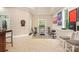 Spacious exercise room with treadmill, bike, and dartboard, perfect for staying active and entertained at 1713 Mt Isle Harbor Dr, Charlotte, NC 28214