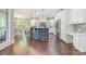 Modern kitchen featuring white cabinetry, a center island with seating, and stainless steel appliances; perfect for cooking and entertaining at 1713 Mt Isle Harbor Dr, Charlotte, NC 28214