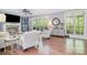 Bright living room featuring a fireplace, large windows with natural light, and elegant decor for comfortable living at 1713 Mt Isle Harbor Dr, Charlotte, NC 28214