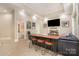 Spacious living room with fireplace, custom bar, and cozy furniture arrangement at 1713 Mt Isle Harbor Dr, Charlotte, NC 28214