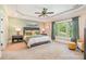 Spacious main bedroom with decorative trey ceiling, lots of natural light, and calming color palette at 1713 Mt Isle Harbor Dr, Charlotte, NC 28214