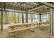 Outdoor picnic area with several tables under a covered pergola with a lake view at 1713 Mt Isle Harbor Dr, Charlotte, NC 28214