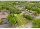 Aerial view of a large grassy lot, framed by mature trees in a residential neighborhood at 182 Ryan St, Salisbury, NC 28144