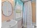 Bathroom featuring a sink, mirror and shower with a floral curtain at 182 Ryan St, Salisbury, NC 28144