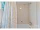 Bathroom featuring a shower/tub with vintage floral shower curtain at 182 Ryan St, Salisbury, NC 28144
