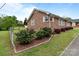 A well manicured yard with garden around a red brick house at 182 Ryan St, Salisbury, NC 28144