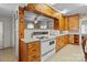 Kitchen featuring vintage oven, white counters, and wood cabinets at 182 Ryan St, Salisbury, NC 28144
