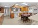 A vintage kitchen featuring a dining table and vintage appliances at 182 Ryan St, Salisbury, NC 28144