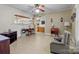Living room featuring wood flooring, and view into the kitchen at 182 Ryan St, Salisbury, NC 28144