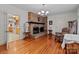 Living room with brick fireplace, wood floors, and neutral colors at 182 Ryan St, Salisbury, NC 28144