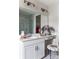 Bright bathroom features a white vanity, a large mirror, and a marble-walled shower, creating a clean, modern aesthetic at 2021 Endeavor Run, Charlotte, NC 28269