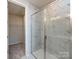 Modern bathroom featuring white marble tile in glass enclosed standing shower at 2021 Endeavor Run, Charlotte, NC 28269