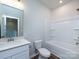 Well-lit bathroom with a bathtub-shower combo and a vanity with a sink at 2021 Endeavor Run, Charlotte, NC 28269
