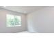 Bright bedroom featuring a large window and neutral carpet at 2021 Endeavor Run, Charlotte, NC 28269