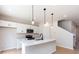 Bright kitchen featuring stainless appliances, white cabinets, and a kitchen island at 2021 Endeavor Run, Charlotte, NC 28269