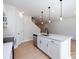 Kitchen island with stainless steel dishwasher and drop lighting at 2021 Endeavor Run, Charlotte, NC 28269