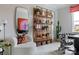 Well-decorated office space with a comfortable chair, shelving, and natural light at 2021 Endeavor Run, Charlotte, NC 28269
