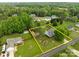 Aerial view showcasing the property's expansive lot, mature trees, and fenced backyard at 230 Castle Keep Rd, Salisbury, NC 28146
