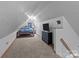 Attic bedroom with carpet, storage, and a window for natural light at 230 Castle Keep Rd, Salisbury, NC 28146