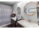 Bathroom showcasing double vanities, octagon mirrors, and tiled shower at 230 Castle Keep Rd, Salisbury, NC 28146