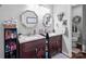Bathroom featuring double sink vanities, decorative mirrors, and updated fixtures at 230 Castle Keep Rd, Salisbury, NC 28146