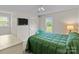 Inviting bedroom featuring an accent wall, a comfy bed, and plenty of natural light at 230 Castle Keep Rd, Salisbury, NC 28146