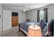 Relaxing bedroom featuring a comfortable bed, dresser, and ample closet space at 230 Castle Keep Rd, Salisbury, NC 28146