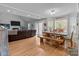Open-concept living and dining area with natural light and seamless flow to the living room at 230 Castle Keep Rd, Salisbury, NC 28146