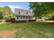 Beautiful exterior view of house, showing dormer windows, and spacious front yard with landscaping at 230 Castle Keep Rd, Salisbury, NC 28146