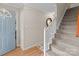 Hallway showcasing wood floors, and carpeted stairs at 230 Castle Keep Rd, Salisbury, NC 28146