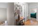 Well-lit hallway with decorative accents leading to bedrooms, offering seamless transition at 230 Castle Keep Rd, Salisbury, NC 28146