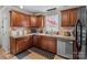 Spacious kitchen features tiled backsplash, granite countertops, stainless steel appliances at 230 Castle Keep Rd, Salisbury, NC 28146